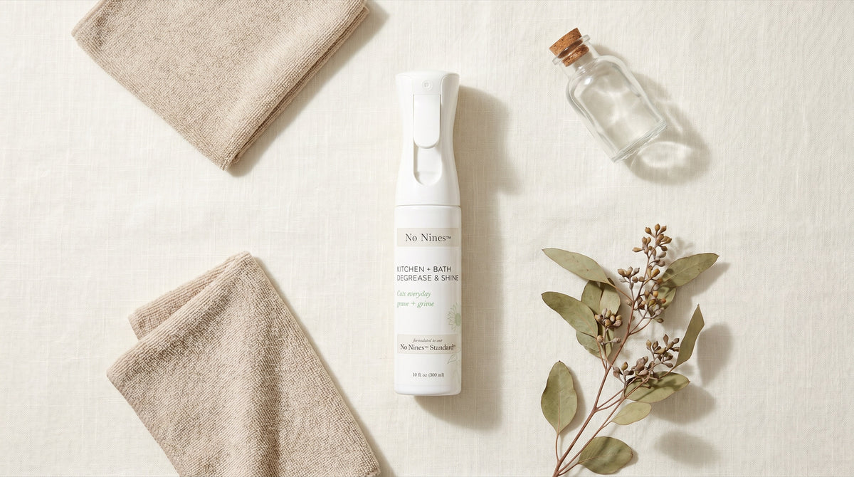 No Nines spray bottle on linen with natural botanicals