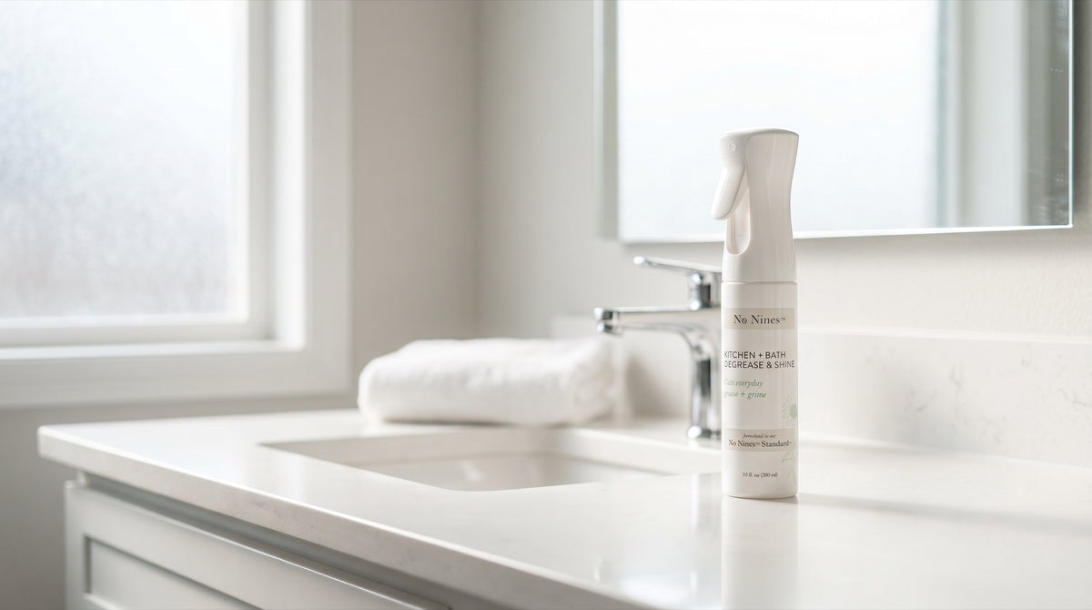 No Nines spray bottle in a bright bathroom